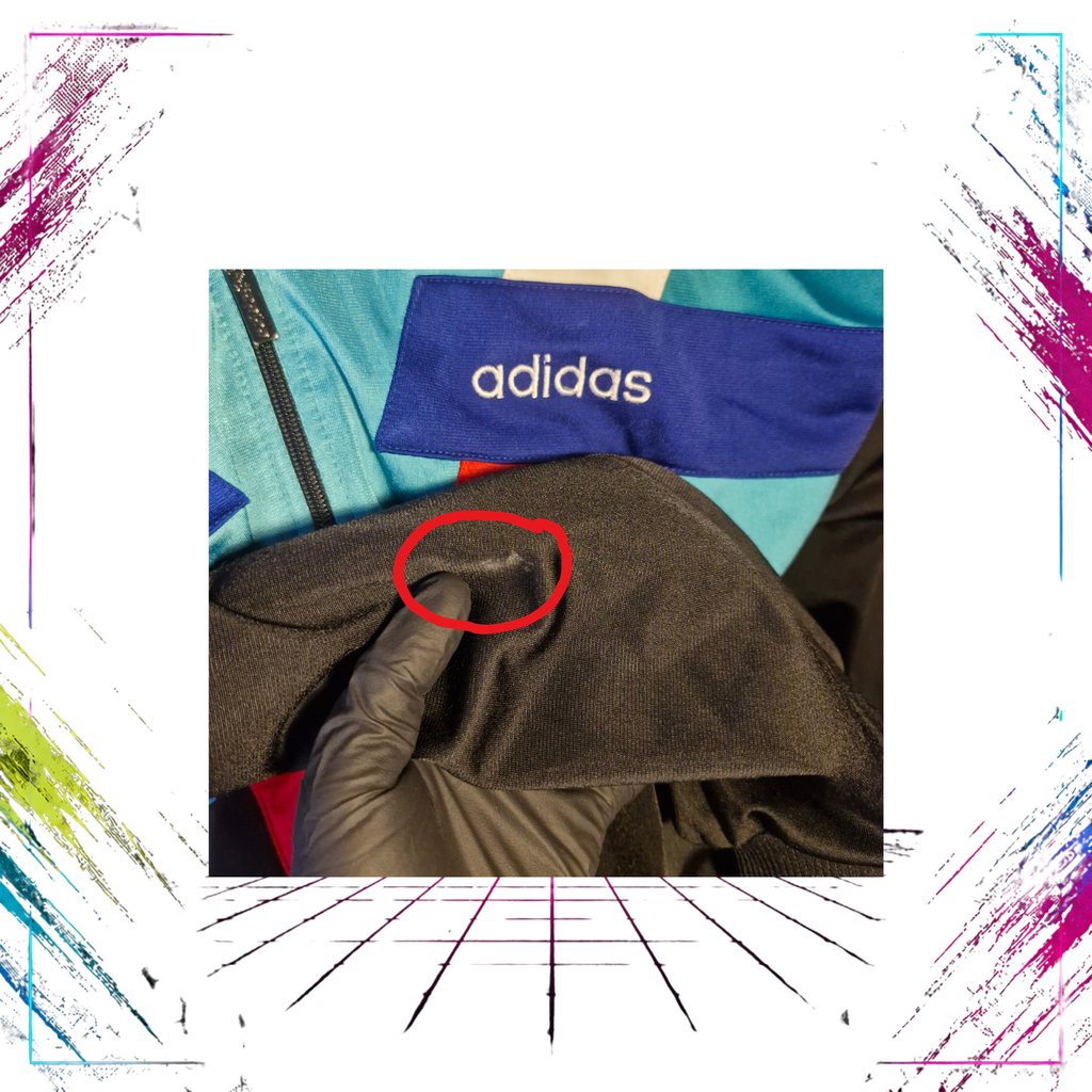 Late 80s Adidas Flag Tag geometric V-line track jacket — right sleeve stain close-up — ThePlugOfVintage